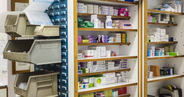 The inside of a pharmacy. Claim auditing can help find duplicate charges. Contact us for pharmacy claim auditing services.